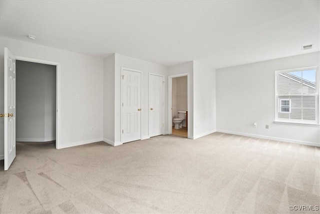 156 Hawk Nest Ct, Richmond, VA 23227 - unfurnished bedroom with light colored carpet and ensuite bathroom