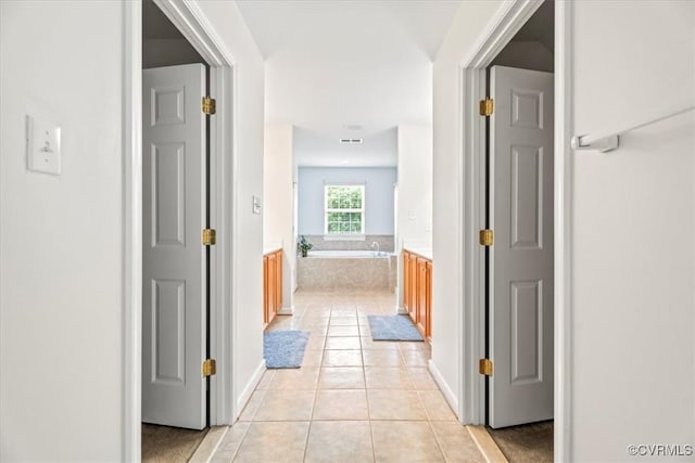 156 Hawk Nest Ct, Richmond, VA 23227 - hallway with light tile patterned flooring and baseboards