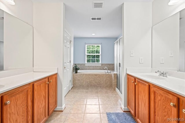 156 Hawk Nest Ct, Richmond, VA 23227 - bathroom with vanity, a garden tub, tile patterned floors, and a stall shower