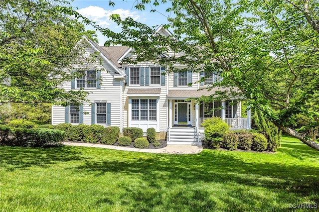 view of front of house featuring a porch and a front lawn