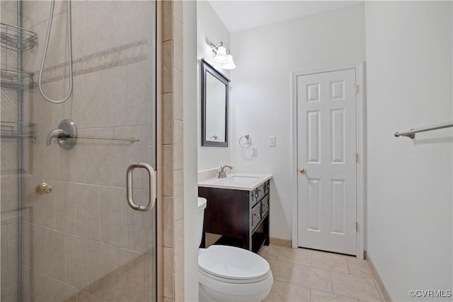 full bathroom with toilet, tile patterned floors, a shower stall, and vanity