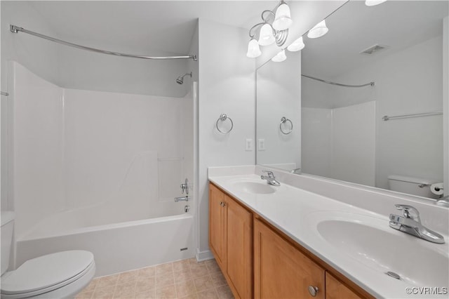 bathroom featuring shower / washtub combination, visible vents, toilet, and a sink
