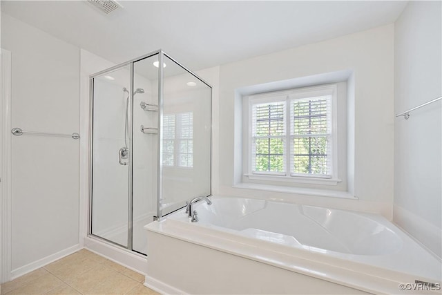 bathroom featuring tile patterned floors, visible vents, a shower stall, and a bath