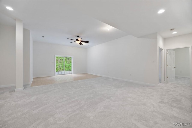 empty room featuring recessed lighting, a ceiling fan, light colored carpet, and baseboards