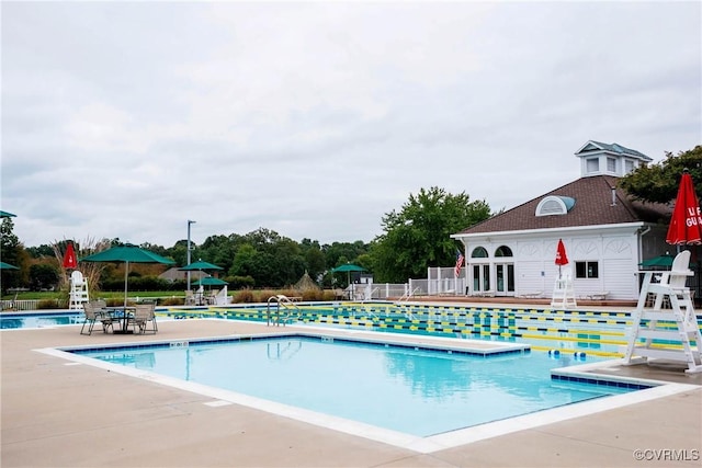 community pool with a patio