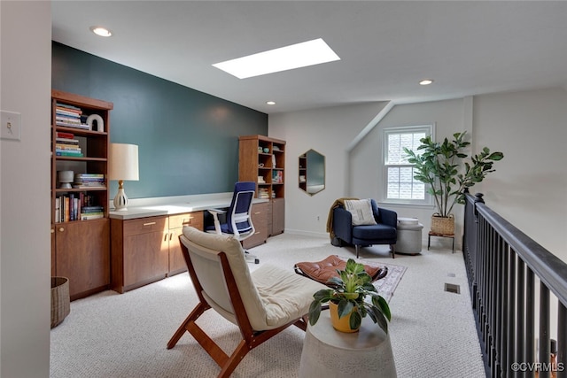 office with recessed lighting, a skylight, and light carpet