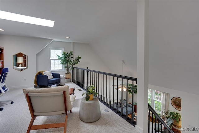 office with baseboards, carpet, and vaulted ceiling