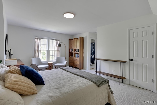 bedroom featuring light carpet