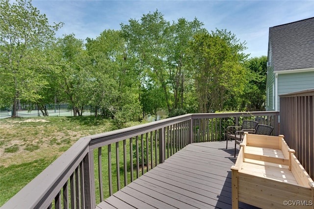 deck featuring a yard
