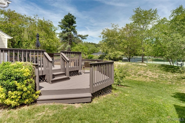 deck with fence and a yard