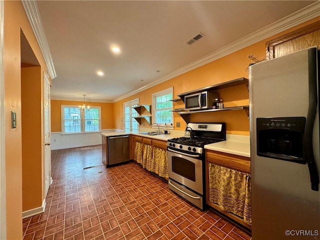 kitchen with crown molding, open shelves, a sink, brick patterned floor, and stainless steel appliances