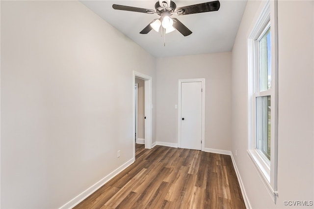 21300 W St, South Chesterfield, VA 23803 - spare room with a healthy amount of sunlight, a ceiling fan, dark wood-style floors, and baseboards