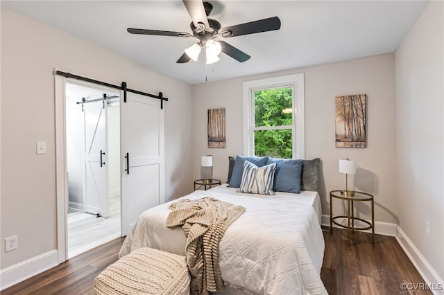 21300 W St, South Chesterfield, VA 23803 - bedroom featuring dark wood-style floors, ceiling fan, a barn door, and baseboards