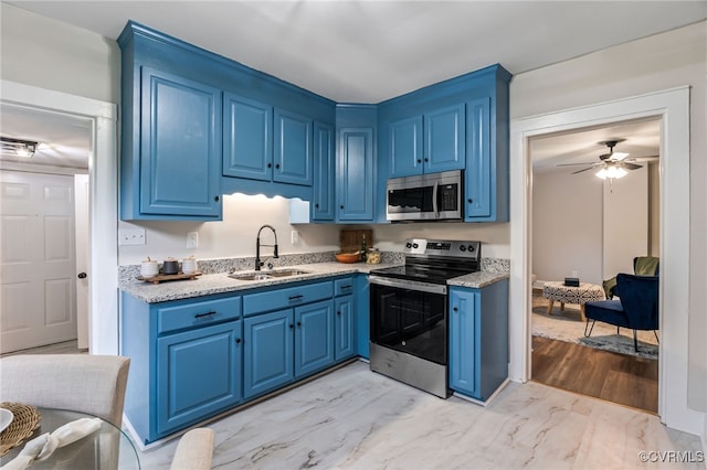 21300 W St, South Chesterfield, VA 23803 - kitchen with a sink, stainless steel appliances, ceiling fan, blue cabinetry, and marble finish floor