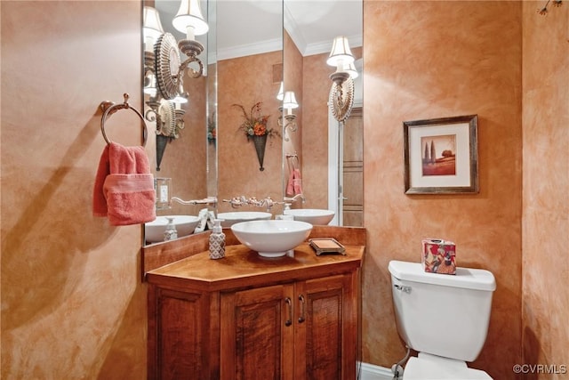 bathroom with vanity, ornamental molding, visible vents, and toilet