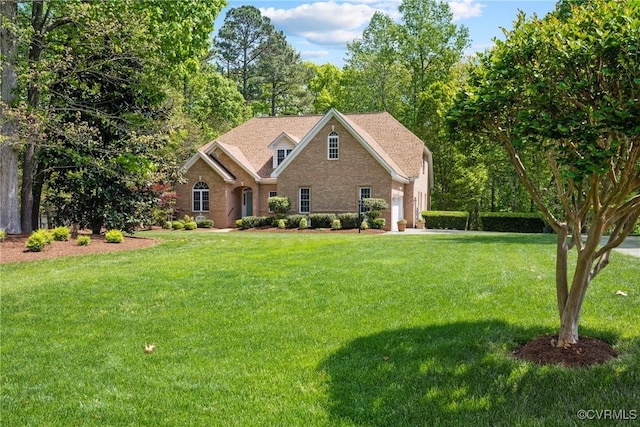 view of front facade with a garage and a front yard