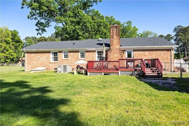 204 Pine St, Jarratt, VA 23867 - rear view of property featuring a chimney, a deck, brick siding, fence, and a yard