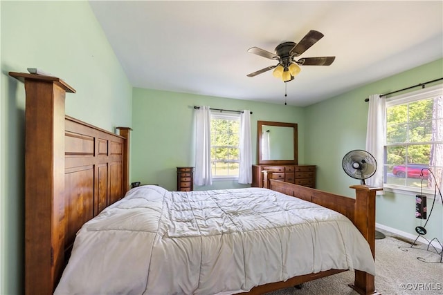 204 Pine St, Jarratt, VA 23867 - carpeted bedroom with baseboards, a ceiling fan, and multiple windows