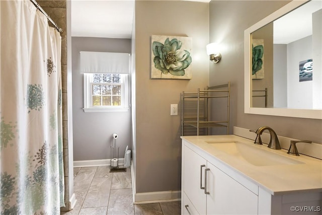204 Pine St, Jarratt, VA 23867 - full bathroom featuring a shower with curtain, baseboards, vanity, and marble finish floor