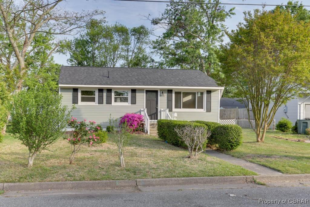 3311 Greenwood Dr, Hampton, VA 23666 - view of front of home with a front lawn, roof with shingles, and fence