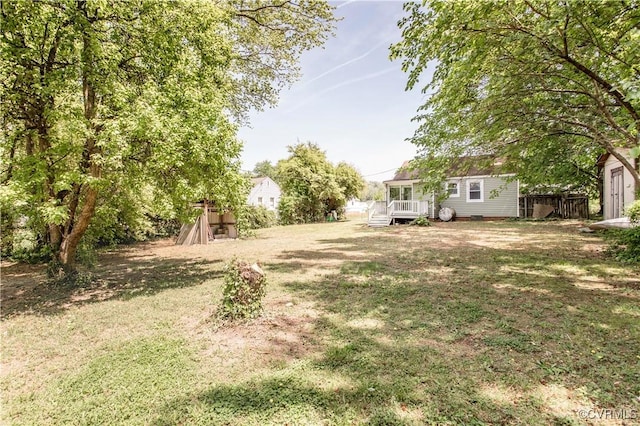 view of yard with a wooden deck
