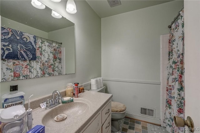 bathroom featuring visible vents, a shower with curtain, toilet, and vanity