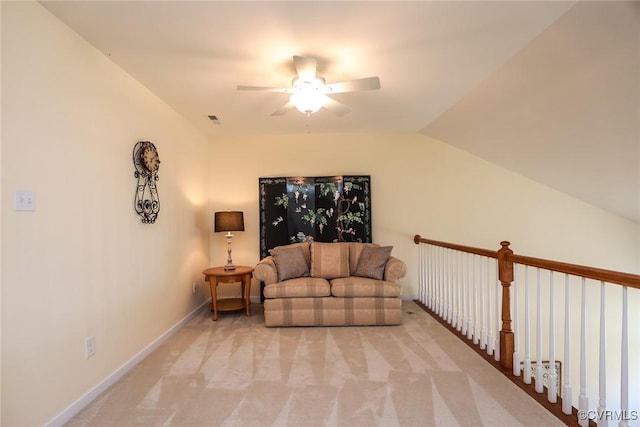 sitting room with a ceiling fan, baseboards, light colored carpet, and visible vents