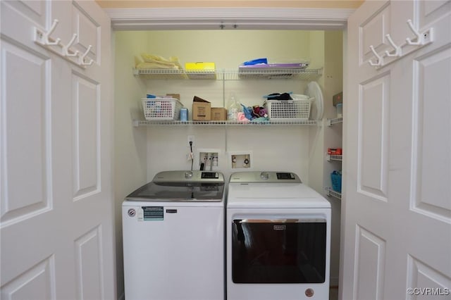 clothes washing area featuring laundry area and washing machine and dryer