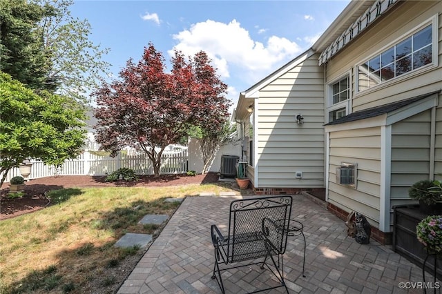 view of patio / terrace featuring fence and central AC unit
