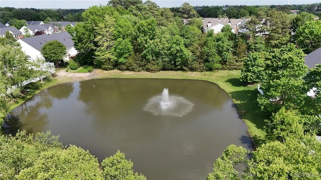 drone / aerial view featuring a water view and a residential view