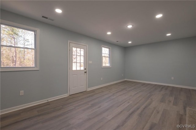 foyer entrance featuring wood finished floors, visible vents, and recessed lighting
