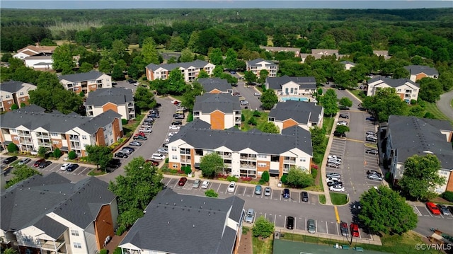aerial perspective of suburban area with a heavily wooded area