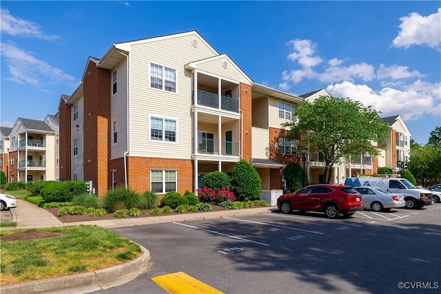 view of property with uncovered parking