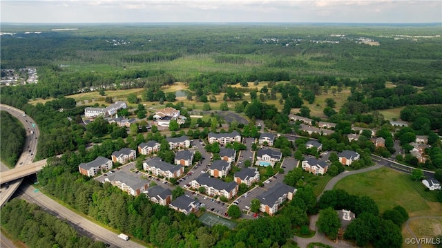 aerial view of property's location with a forest
