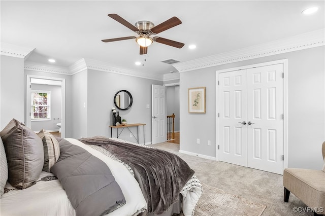 bedroom featuring recessed lighting, light carpet, ornamental molding, baseboards, and a closet