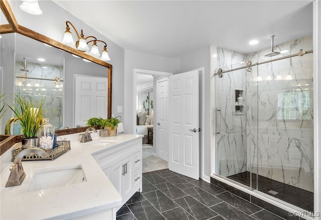 ensuite bathroom featuring marble finish floors, a marble finish shower, and double vanity