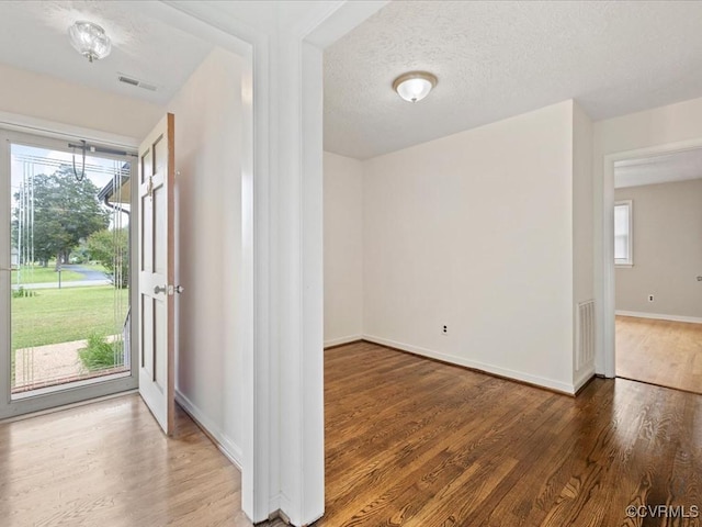 10811 Shady Ln, Charles City, VA 23030 - foyer with wood finished floors, baseboards, and a textured ceiling