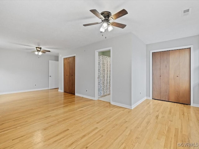 10811 Shady Ln, Charles City, VA 23030 - unfurnished living room with ceiling fan, light wood finished floors, and baseboards