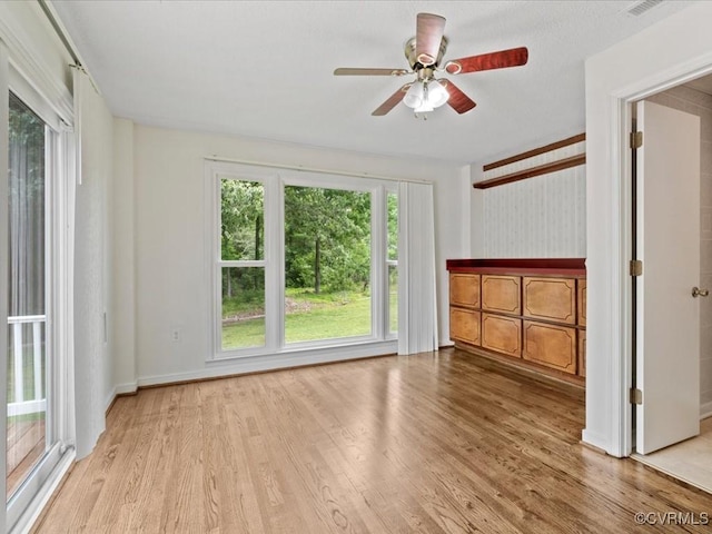 10811 Shady Ln, Charles City, VA 23030 - unfurnished living room with wood finished floors and a ceiling fan