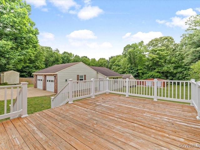 10811 Shady Ln, Charles City, VA 23030 - wooden terrace with an outbuilding, a lawn, a detached garage, and view of wooded area