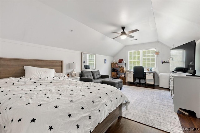 bedroom with dark wood-style flooring, ceiling fan, visible vents, and lofted ceiling