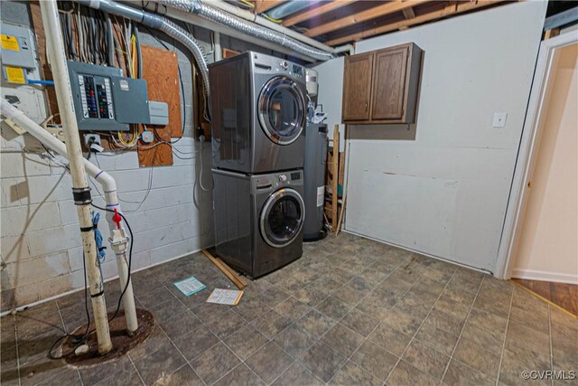 10 Mahon, Ruther Glen, VA 22546 - washroom with stacked washer / drying machine, electric panel, water heater, cabinet space, and concrete block wall
