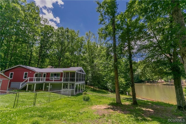 10 Mahon, Ruther Glen, VA 22546 - view of yard with a sunroom and a deck with water view