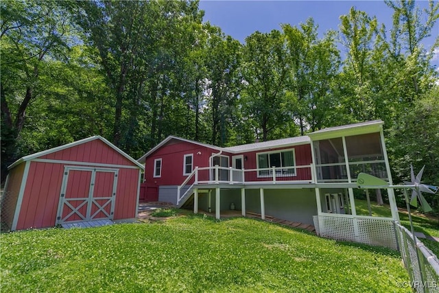 10 Mahon, Ruther Glen, VA 22546 - rear view of house featuring stairway, a lawn, a sunroom, and a wooden deck