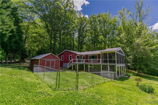 10 Mahon, Ruther Glen, VA 22546 - rear view of house featuring a deck and a sunroom