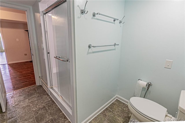 10 Mahon, Ruther Glen, VA 22546 - full bath featuring a stall shower, baseboards, and toilet
