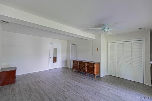 10 Mahon, Ruther Glen, VA 22546 - unfurnished living room featuring wood finished floors, a ceiling fan, and baseboards
