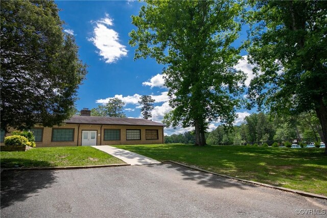 10 Mahon, Ruther Glen, VA 22546 - ranch-style house with a chimney and a front yard