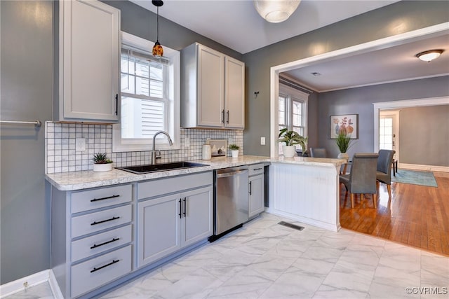 kitchen featuring gray cabinetry, stainless steel dishwasher, marble finish floor, and a sink