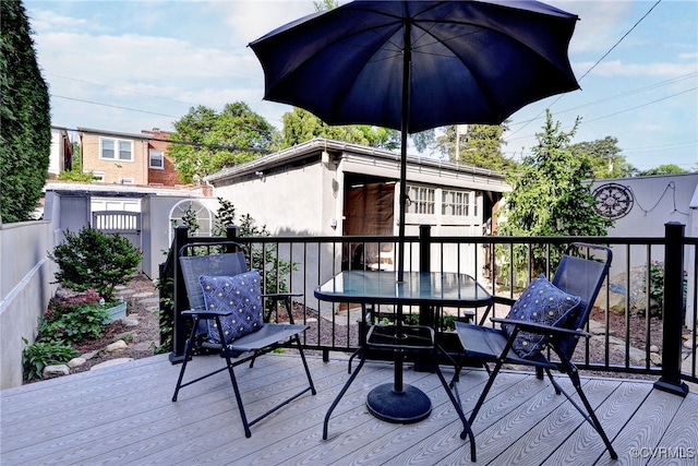 wooden deck featuring a fenced backyard and outdoor dining area